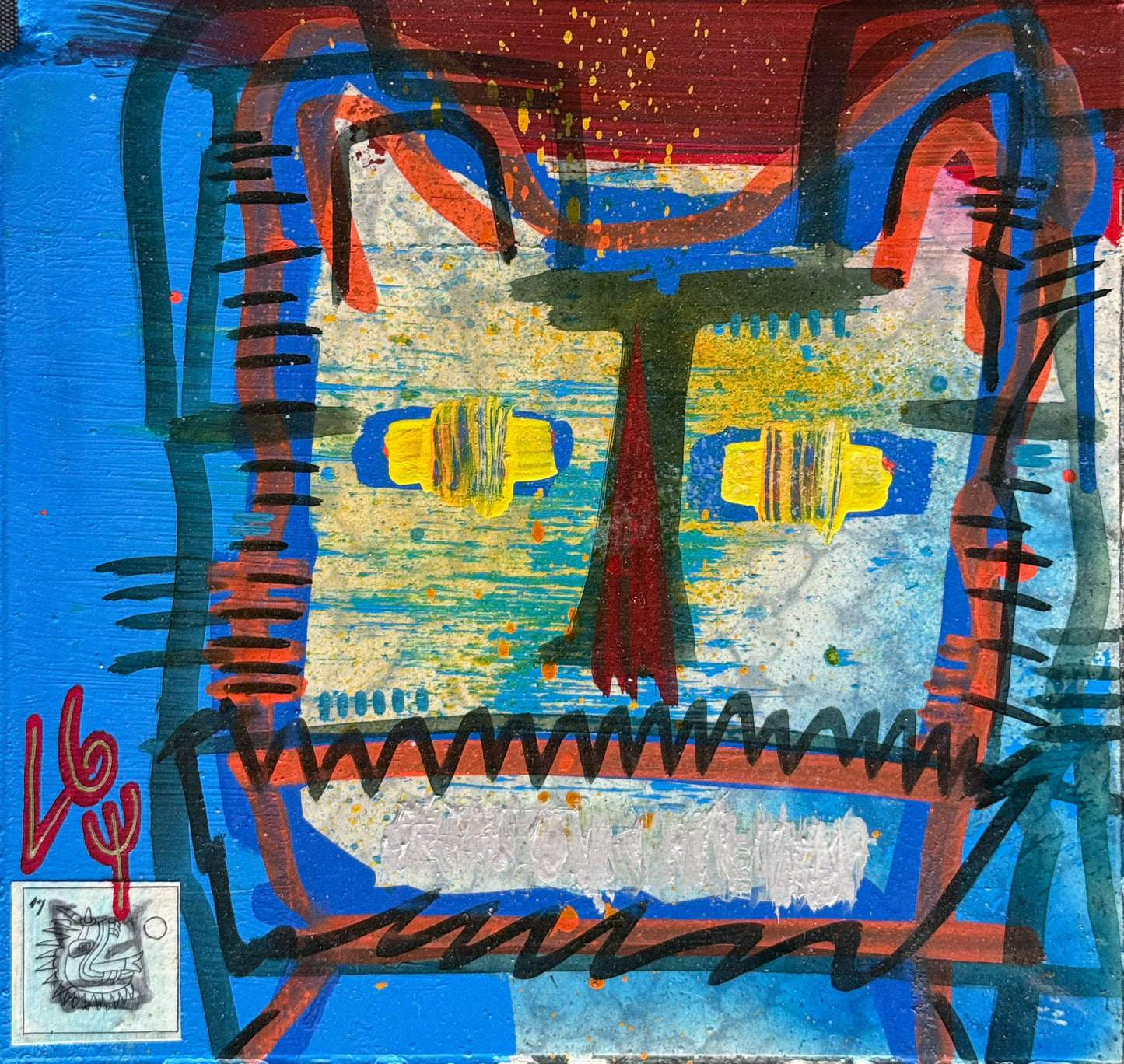 LOTE 114 / Luis Guillermo González - Máscara de gato / Pintura base agua y vinilo, sello acrílico - 26 X 26 cm