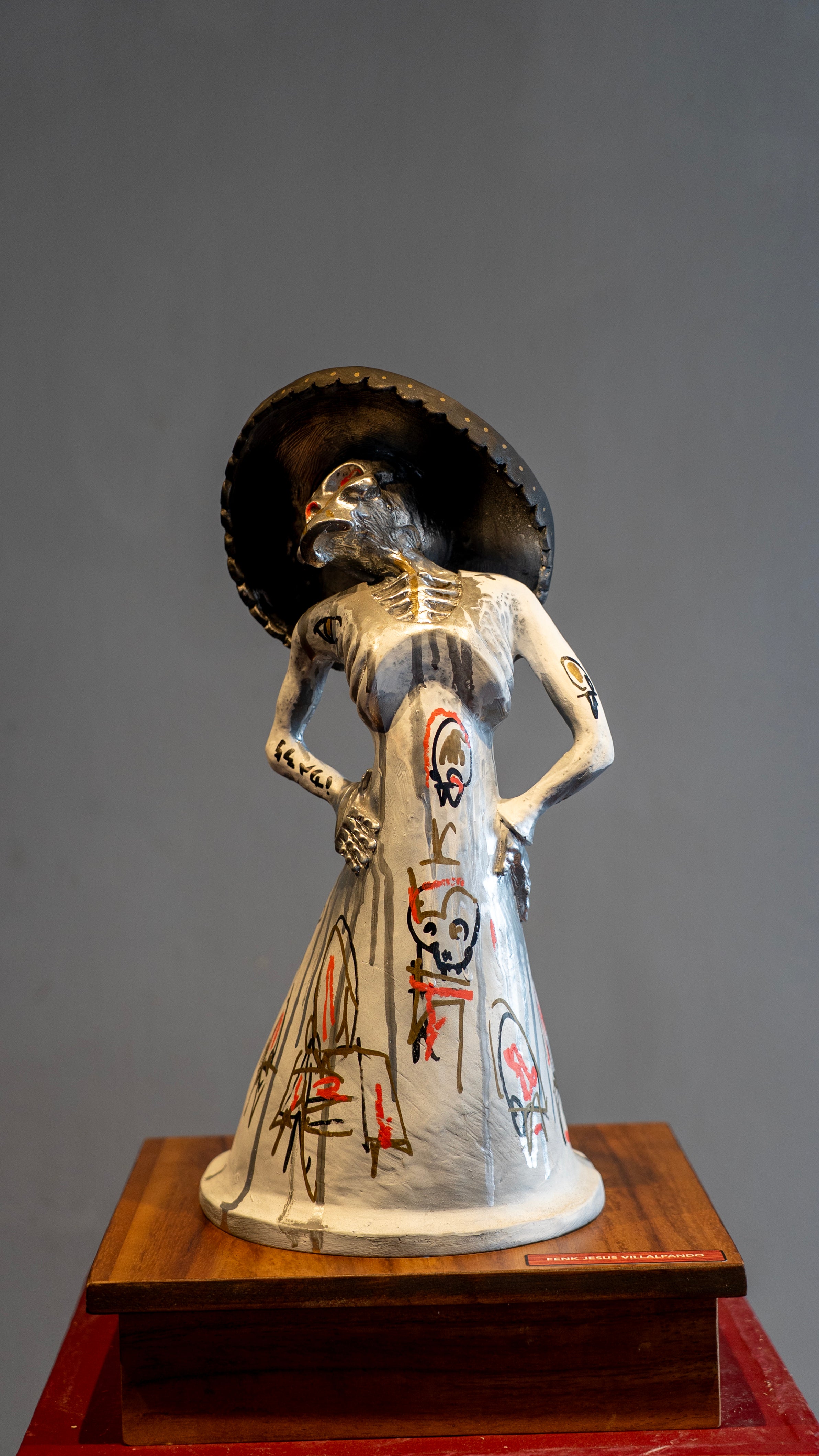 Feng Jesus Villalpando – ST Catrina con craneos / Mixta sobre madera – 29 x 50 cm –